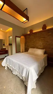 Uma cama ou camas num quarto em Villa Biju