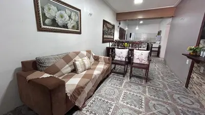 Uma área de estar em Casa da Ana Júlia