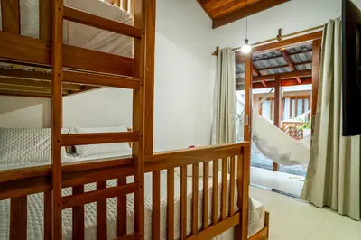 Uma cama ou camas num quarto em Villa do Ze