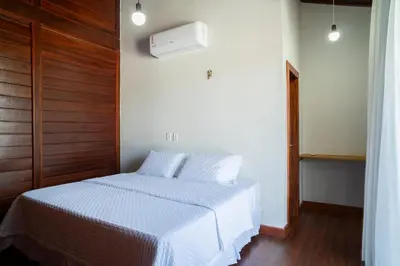 Uma cama ou camas num quarto em Villa do Ze