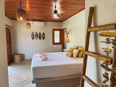 Uma cama ou camas num quarto em Casa Devagar Icaraizinho