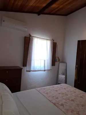 Uma cama ou camas num quarto em Casa Barrinha