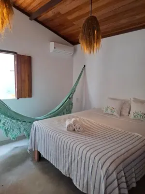 Uma cama ou camas num quarto em Casa Barrinha