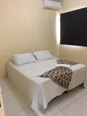Uma cama ou camas num quarto em Cristiano hospedagem