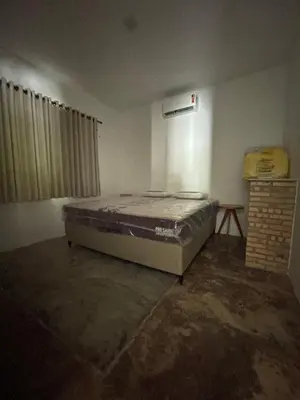 Uma cama ou camas num quarto em Pindoretama sitio
