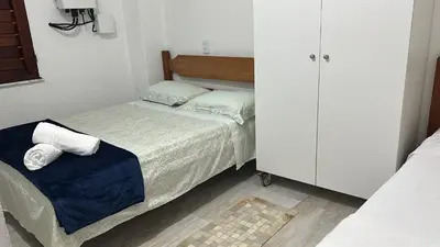 Uma cama ou camas num quarto em Casa de Praia Aconchegante