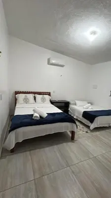 Uma cama ou camas num quarto em Casa de Praia Aconchegante