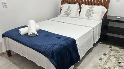 Uma cama ou camas num quarto em Casa de Praia Aconchegante