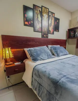 Uma cama ou camas num quarto em Lemos Surf House Piscina, Lazer e 100m da Praia