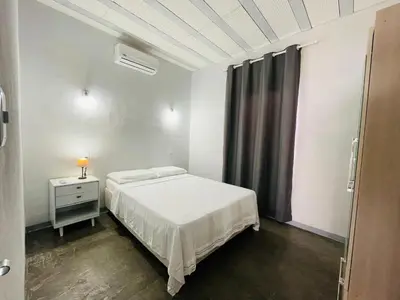 Uma cama ou camas num quarto em CASA Les Deux R da Lagoa