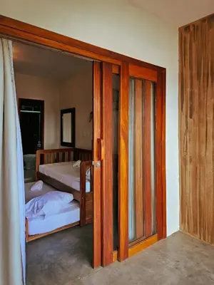 Uma cama ou camas num quarto em Casa Downwind