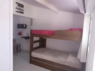 Uma cama ou camas num quarto em Cobertura solariun com 2 suites na praia do prea