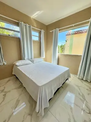 Uma cama ou camas num quarto em Casa flecheiras aconchego
