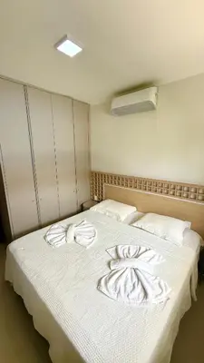 Uma cama ou camas num quarto em Condomínio Boas vistas