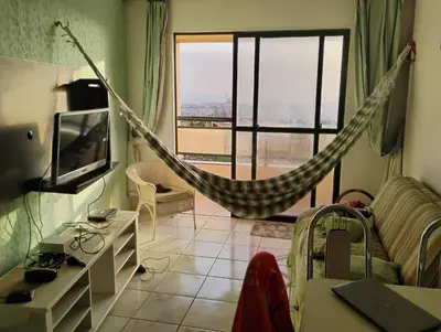 Uma televisão e/ou sistema de entretenimento em Flat 500 MTS do Beach park
