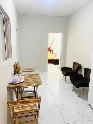 Uma área de estar em Apartamento Dunas