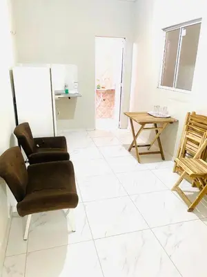 Uma área de estar em Apartamento Dunas