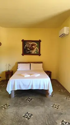 Uma cama ou camas num quarto em Espaço Akronos Residence