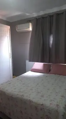 Uma cama ou camas num quarto em Apartamento em bairro nobre de Fortaleza