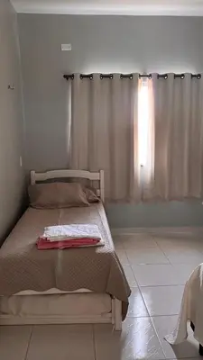 Uma cama ou camas num quarto em Mirante Paraíso Residencial