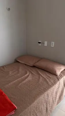 Uma cama ou camas num quarto em Mirante Paraíso Residencial