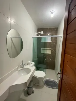 Uma casa de banho em Suítes Paraíso Perfeito