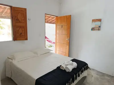 Uma cama ou camas num quarto em Oásis