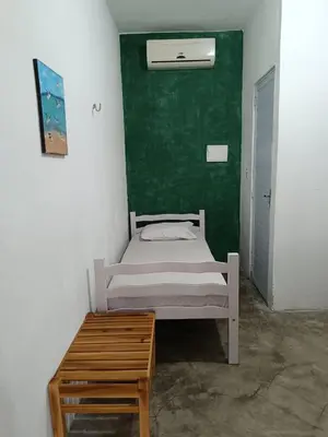 Uma cama ou camas num quarto em Oásis