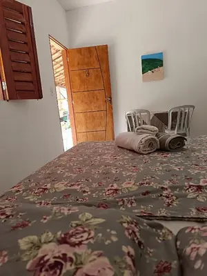 Uma cama ou camas num quarto em Oásis