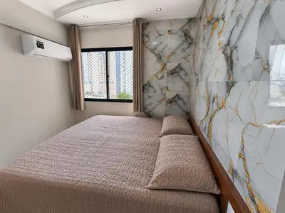 Uma cama ou camas num quarto em Fortaleza Praia iracema apartamento Guanaces vista mar