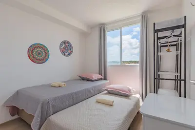 Uma cama ou camas num quarto em Mirante Clube #606 - Apto 2 Quartos by Carpediem