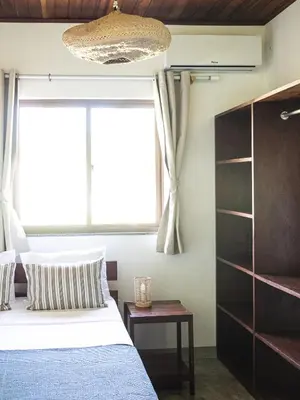 Uma cama ou camas num quarto em Kite Oasis Parajuru Casa Branca