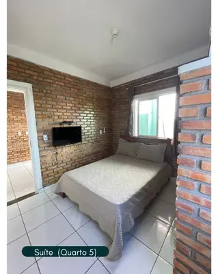 Uma cama ou camas num quarto em Condomínio Chalés Santo Antônio - Flecheiras