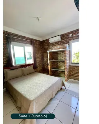 Uma cama ou camas num quarto em Condomínio Chalés Santo Antônio - Flecheiras