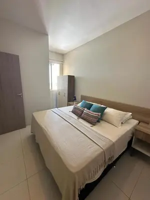 Uma cama ou camas num quarto em Cumbuco Residence
