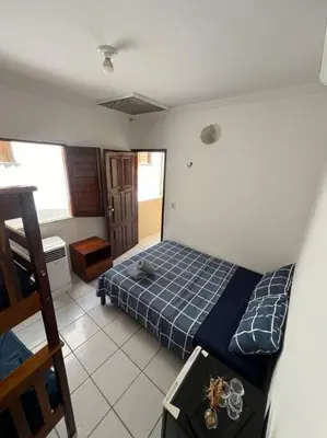 Uma cama ou camas num quarto em Suíte Céu e Mar - Super Localização