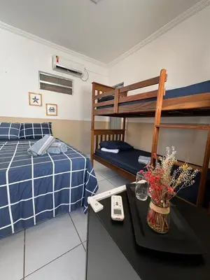 Uma cama ou camas num quarto em Suíte Pé na Areia - Super Local