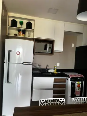 A cozinha ou kitchenette de Beach Way, ap pé na areia, no Porto das Dunas, pertinho do Beach Park