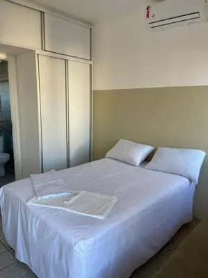 Uma cama ou camas num quarto em Flat 2 suítes no Porto das Dunas