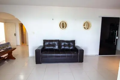 Uma área de estar em Casa Vista ao Mar - Paisagem Deslumbrante e Localização Perfeita