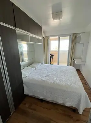 Uma cama ou camas num quarto em Condomínio Beach Village vista mar