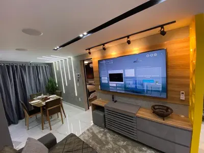 Uma televisão e/ou sistema de entretenimento em Apartamento de luxo na Beira Mar