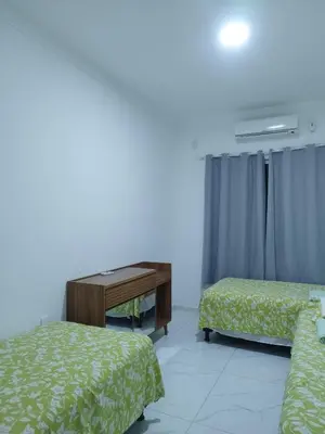 Uma cama ou camas num quarto em Casa Praia Paracuru - Orquídeas de Célia