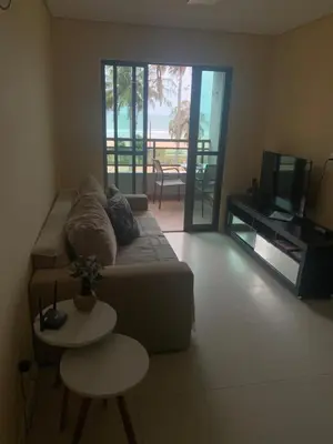 Uma televisão e/ou sistema de entretenimento em Flecheiras Residence