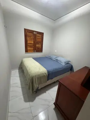 Uma cama ou camas num quarto em Refúgio a Beira Mar