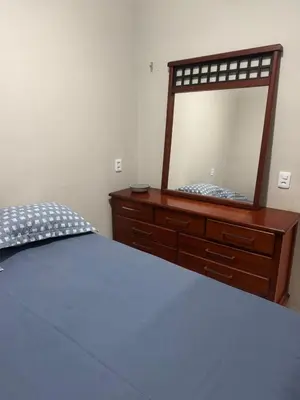 Uma cama ou camas num quarto em Refúgio a Beira Mar