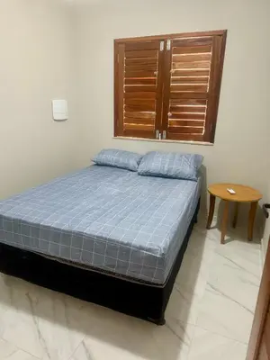 Uma cama ou camas num quarto em Refúgio a Beira Mar