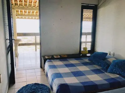 Uma cama ou camas num quarto em Casa Jangada - Incrível vista mar com Piscina e a melhor localização na Beira Mar da Taíba