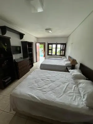 Uma cama ou camas num quarto em Mansão lagoa do catu