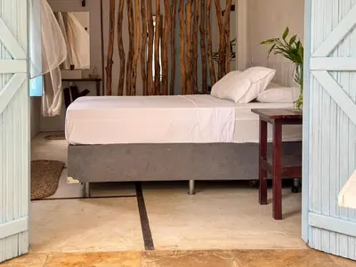 Uma cama ou camas num quarto em Vento do Ceará -Kitesurfing House- Preá